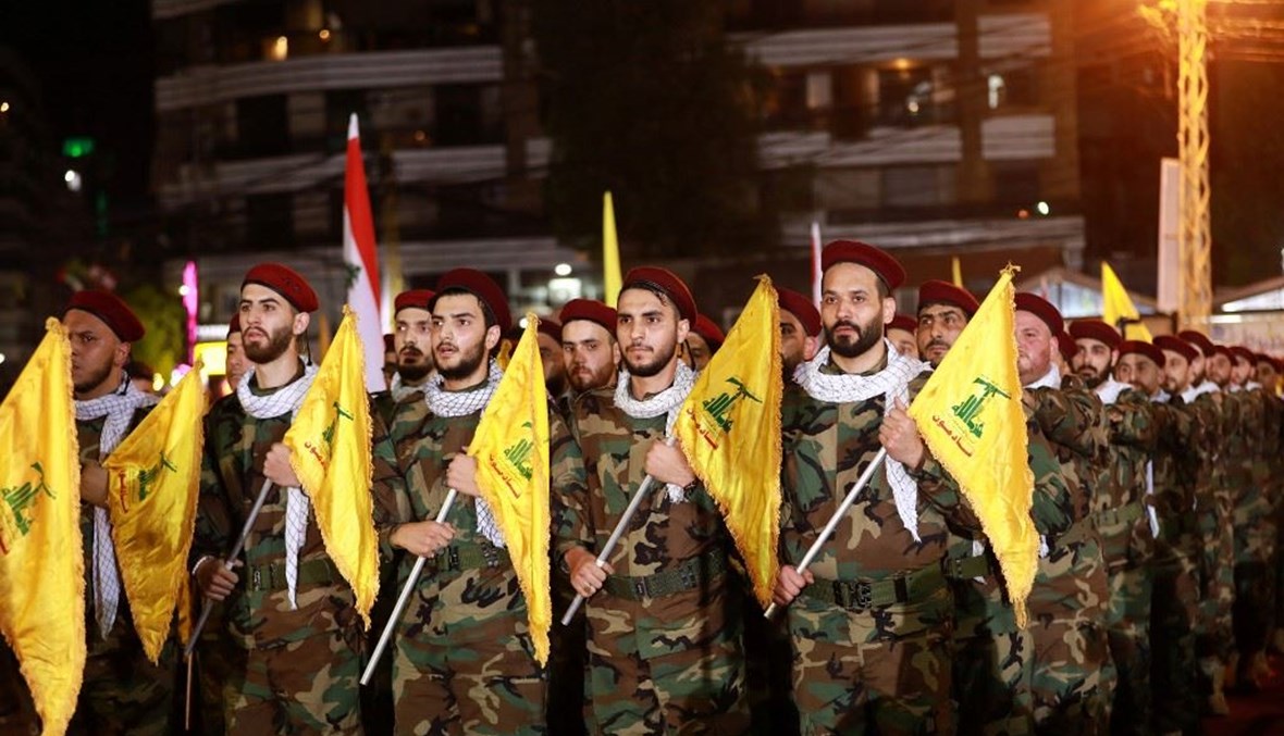 مقاتلون من "حزب الله" خلال استعراض في الضاحية الجنوبية (أ ف ب). 